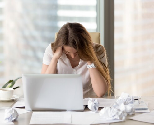 Stressed female entrepreneur in creativity crisis